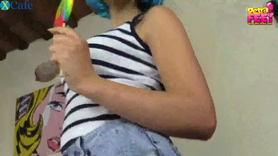 Sexy girl in blue wig Petra licks a big lollipop and takes her socks off