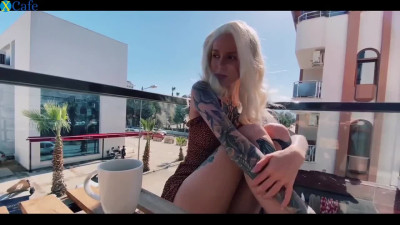 Tatooed blonde toying with herself in public