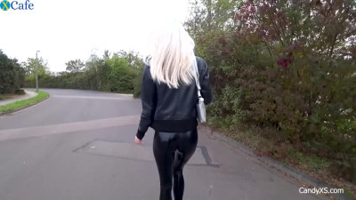 Latex Clad Blonde fucks in a public toilet