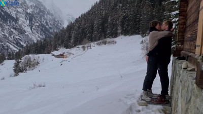 Couple enjoys hidden passionate lovemaking during winter mountain trip