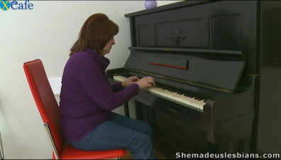 Horny piano teacher shows her tits to her lustful students