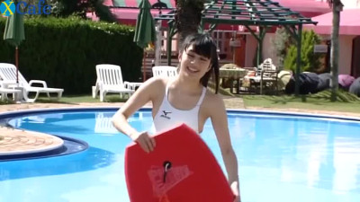 Salty Japanese cutie demonstrates her booty while swimming in pool