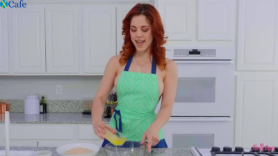 Hot redhead housewife with big boobs has a sex toy to insert into her pussy