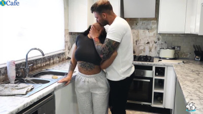 Brunette MILF with big tits fucked in the kitchen by a tattooed stud