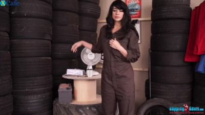 This sexy female mechanic knows how to put on a good striptease show