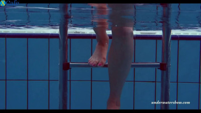 Busty teen Piyavka Chehova swimming in a pool like a mermaid